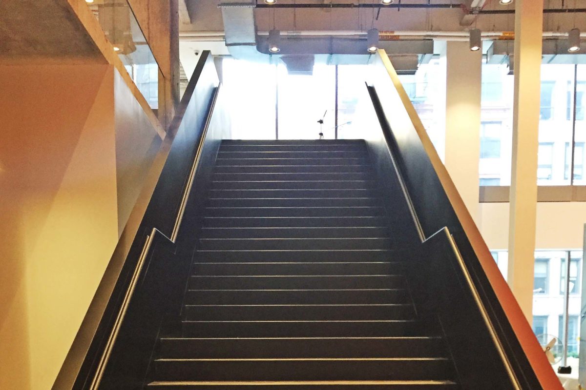 Mistral Fabricated Design Build Stair Including All Structural Steel, Integrated Handrail On Guardrail In Blackened Steel Finish.