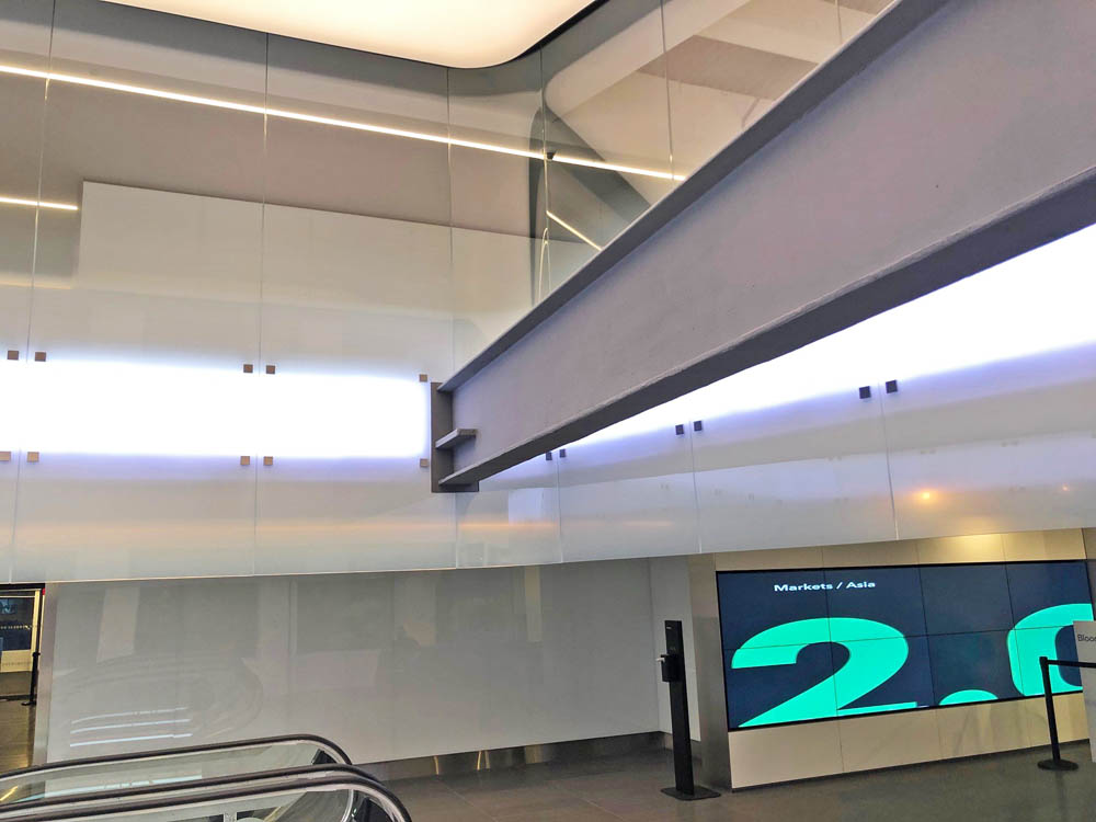 Custom Oversized Fritted Flat + Curved Glass Panels In Atrium.