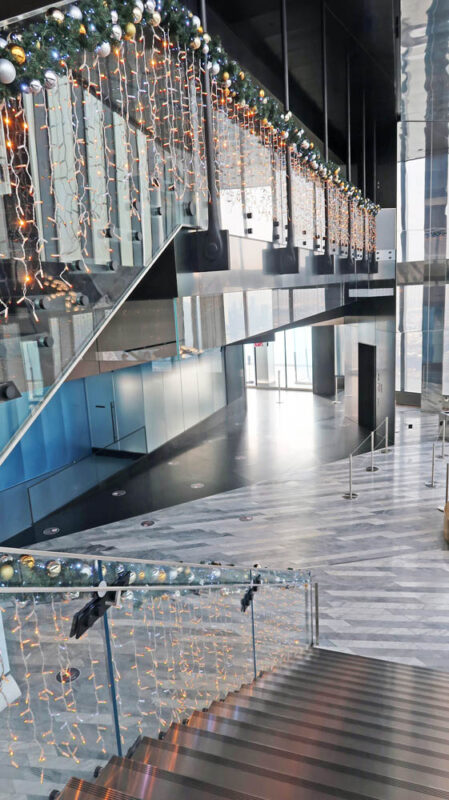 Design-build Structural Glass Guardrail With Floating Stainless Steel Treads.